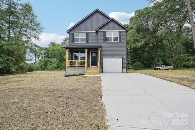 401 W Charlotte Ave, Mount Holly, NC 28120 - view of front of property featuring covered porch, concrete driveway, an attached garage, and a front lawn