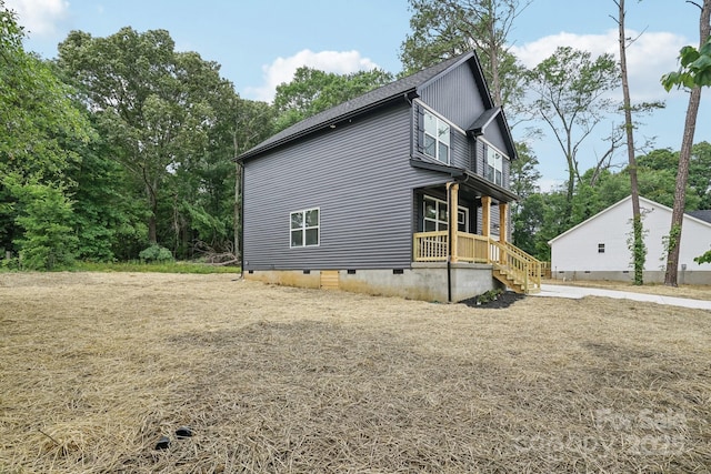 401 W Charlotte Ave, Mount Holly, NC 28120 - view of side of property with crawl space and a porch