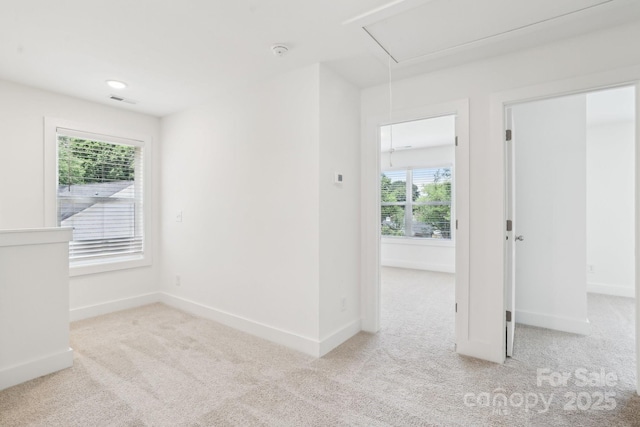 401 W Charlotte Ave, Mount Holly, NC 28120 - carpeted spare room with attic access, baseboards, and a smoke detector