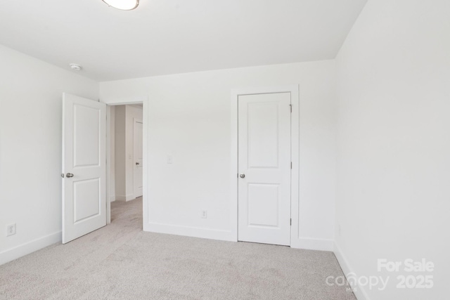 401 W Charlotte Ave, Mount Holly, NC 28120 - unfurnished bedroom with carpet floors and baseboards