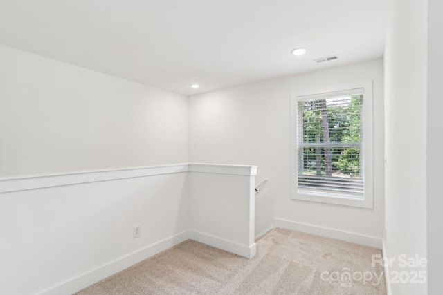 401 W Charlotte Ave, Mount Holly, NC 28120 - spare room with light colored carpet, baseboards, and recessed lighting