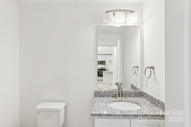 401 W Charlotte Ave, Mount Holly, NC 28120 - half bathroom featuring toilet and vanity