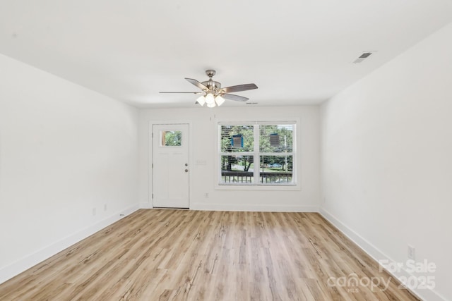 401 W Charlotte Ave, Mount Holly, NC 28120 - foyer with light wood-style flooring, baseboards, and ceiling fan
