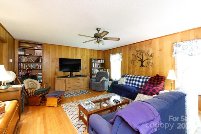 517 Powell St, Rock Hill, SC 29732 - living room with wooden walls, a ceiling fan, and wood finished floors
