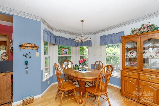 517 Powell St, Rock Hill, SC 29732 - dining space featuring light wood-type flooring, baseboards, and a chandelier