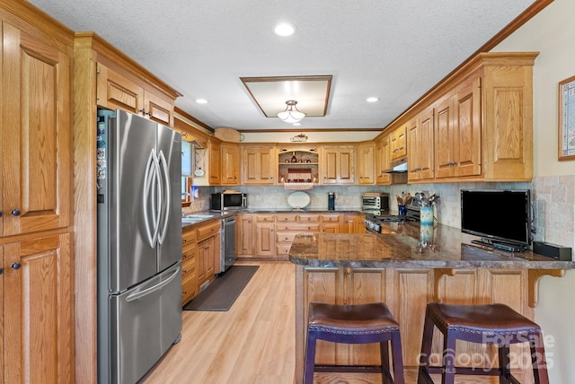 250 Huey Rd, Marshall, NC 28753 - kitchen featuring stainless steel appliances, a peninsula, open shelves, light wood-type flooring, and under cabinet range hood
