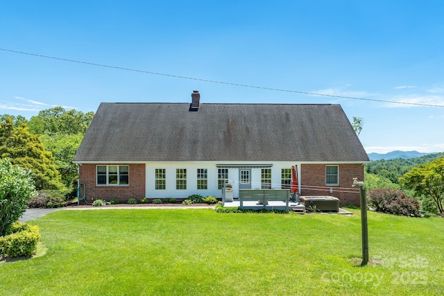 250 Huey Rd, Marshall, NC 28753 - view of front facade with a hot tub, a front lawn, brick siding, and a chimney