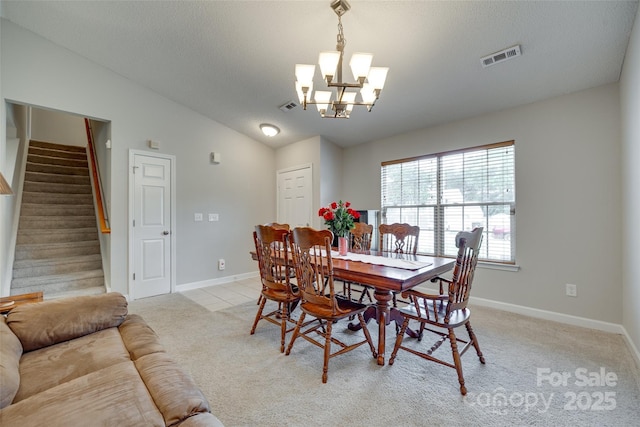 1791 Rosewell Dr Unit 65, Rock Hill, SC 29732 - dining room with stairway, a chandelier, baseboards, light colored carpet, and lofted ceiling
