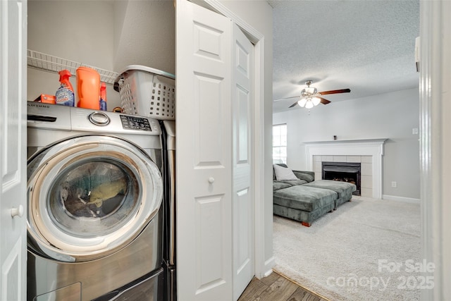 1791 Rosewell Dr Unit 65, Rock Hill, SC 29732 - laundry area featuring washer / clothes dryer, a ceiling fan, a tile fireplace, wood finished floors, and baseboards