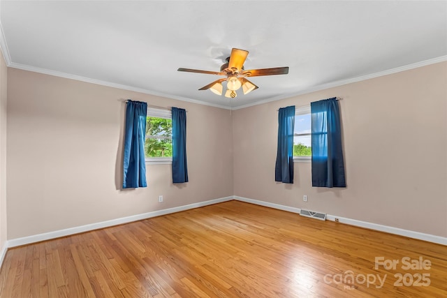 1125 Windy Acres St, Morganton, NC 28655 - spare room featuring light wood-type flooring, baseboards, ornamental molding, and a ceiling fan