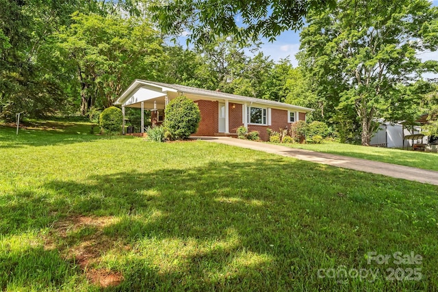 1125 Windy Acres St, Morganton, NC 28655 - single story home featuring a front yard, concrete driveway, brick siding, and an attached carport