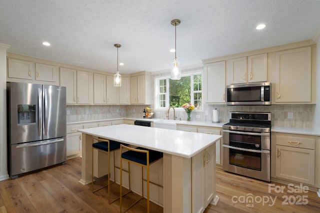 16132 Mclester Rd, Oakboro, NC 28129 - kitchen with appliances with stainless steel finishes, light wood finished floors, light countertops, and recessed lighting