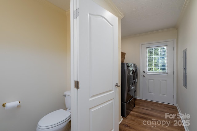 16132 Mclester Rd, Oakboro, NC 28129 - washroom featuring independent washer and dryer, electric panel, wood finished floors, ornamental molding, and a textured ceiling