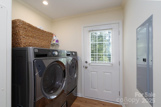 16132 Mclester Rd, Oakboro, NC 28129 - laundry room featuring washer and dryer, wood finished floors, and ornamental molding