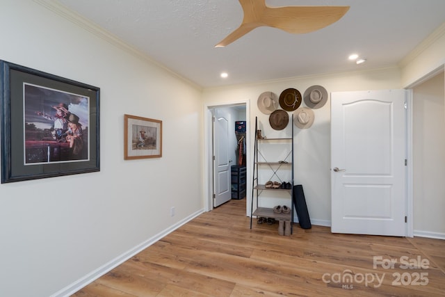 16132 Mclester Rd, Oakboro, NC 28129 - bedroom with crown molding, light wood-type flooring, recessed lighting, baseboards, and a walk in closet