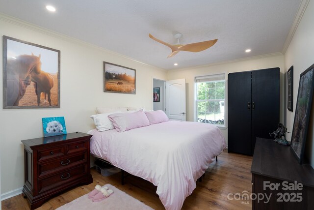 16132 Mclester Rd, Oakboro, NC 28129 - bedroom with crown molding, wood finished floors, recessed lighting, and a ceiling fan