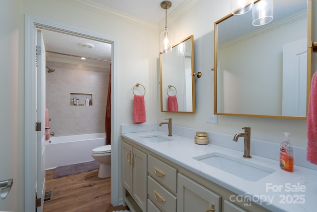 16132 Mclester Rd, Oakboro, NC 28129 - bathroom featuring crown molding, toilet, double vanity, wood finished floors, and shower / bath combo