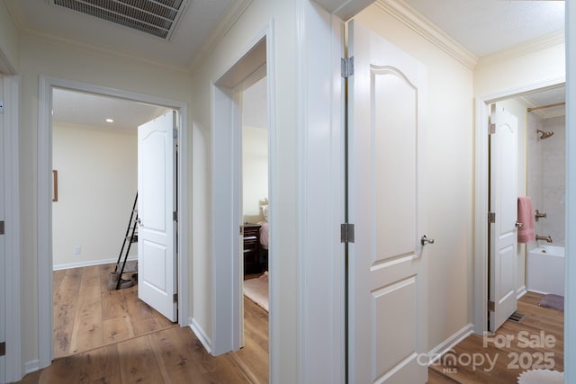 16132 Mclester Rd, Oakboro, NC 28129 - corridor featuring wood finished floors, ornamental molding, and baseboards