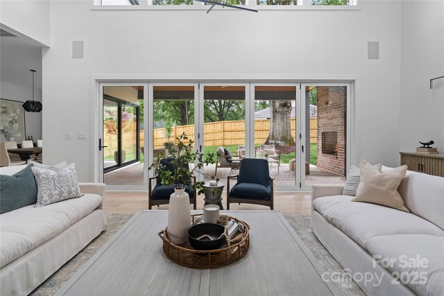 3822 Topsfield Rd, Charlotte, NC 28211 - living area featuring a high ceiling and wood finished floors
