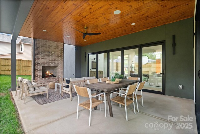 3822 Topsfield Rd, Charlotte, NC 28211 - view of patio / terrace with an outdoor living space with a fireplace and outdoor dining area