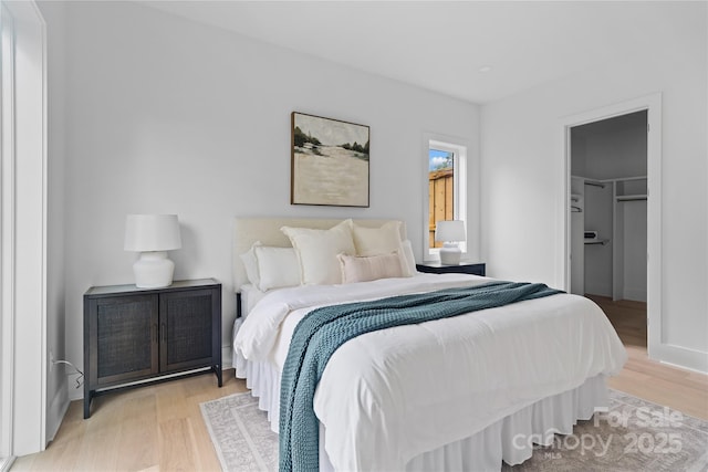 3822 Topsfield Rd, Charlotte, NC 28211 - bedroom with light wood finished floors and a walk in closet