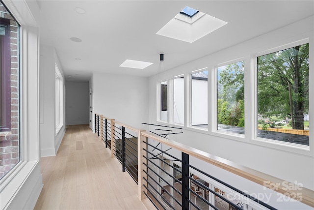 3822 Topsfield Rd, Charlotte, NC 28211 - hallway with a skylight and light wood-type flooring