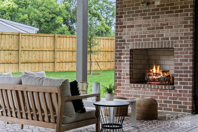 3822 Topsfield Rd, Charlotte, NC 28211 - view of patio with an outdoor living space with a fireplace