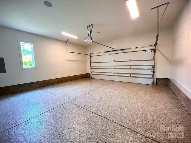 3822 Topsfield Rd, Charlotte, NC 28211 - garage with a garage door opener and baseboards