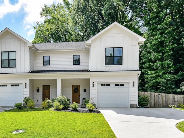 2517 Marlowe Ave, Charlotte, NC 28208 - modern inspired farmhouse with board and batten siding, driveway, a garage, and a porch