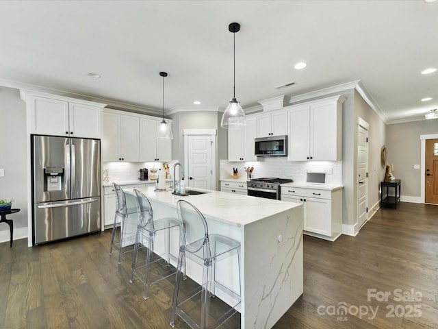 2517 Marlowe Ave, Charlotte, NC 28208 - kitchen with appliances with stainless steel finishes, ornamental molding, a sink, white cabinetry, and recessed lighting