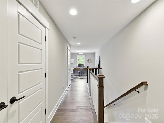 2517 Marlowe Ave, Charlotte, NC 28208 - corridor featuring recessed lighting, dark wood-type flooring, an upstairs landing, a desk, and baseboards