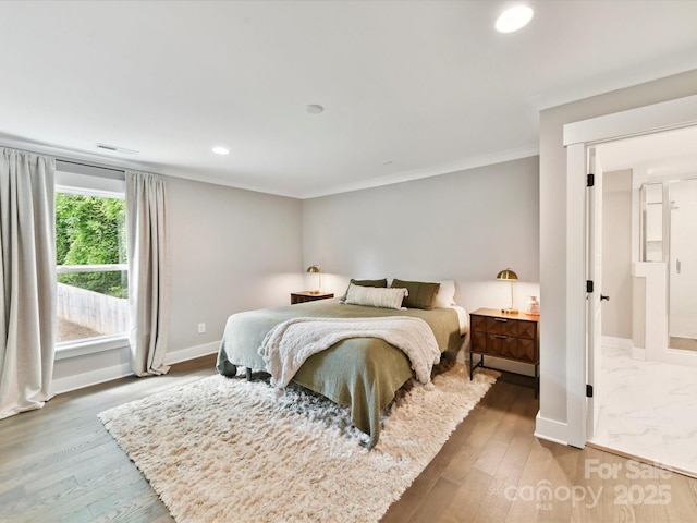 2517 Marlowe Ave, Charlotte, NC 28208 - bedroom with baseboards, wood finished floors, recessed lighting, and crown molding