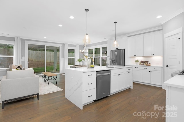2517 Marlowe Ave, Charlotte, NC 28208 - kitchen with appliances with stainless steel finishes, dark wood-style floors, recessed lighting, plenty of natural light, and white cabinetry