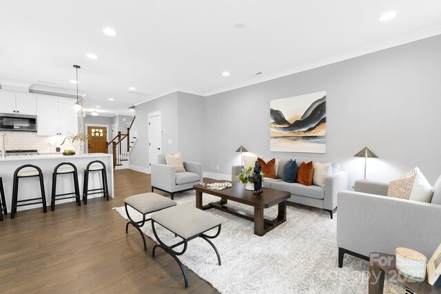 2517 Marlowe Ave, Charlotte, NC 28208 - living area with recessed lighting, crown molding, dark wood-type flooring, and stairway