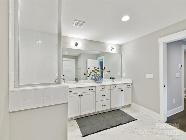 2517 Marlowe Ave, Charlotte, NC 28208 - full bath featuring marble finish floors, double vanity, and recessed lighting