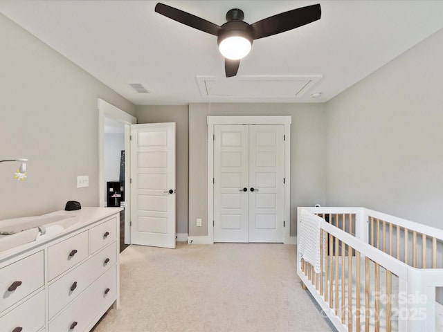 2517 Marlowe Ave, Charlotte, NC 28208 - bedroom featuring attic access, light carpet, a closet, ceiling fan, and a nursery area