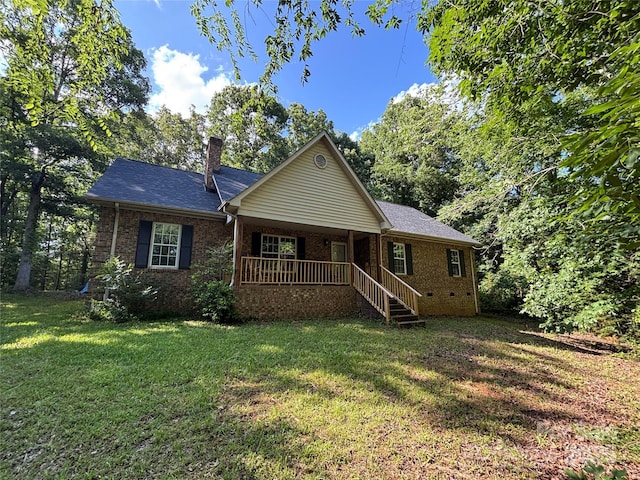 8819 Noah Helms Rd, Indian Trail, NC 28079 - single story home with covered porch, brick siding, a front yard, a chimney, and crawl space