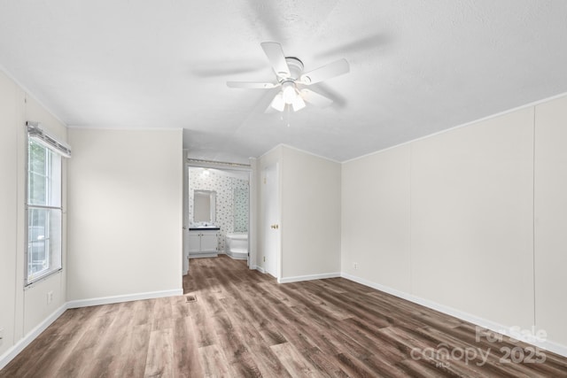 1884 Kensway Dr, Hudson, NC 28638 - spare room featuring wood finished floors, ceiling fan, and baseboards