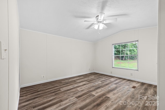 1884 Kensway Dr, Hudson, NC 28638 - empty room with vaulted ceiling, wood finished floors, ceiling fan, a textured ceiling, and baseboards