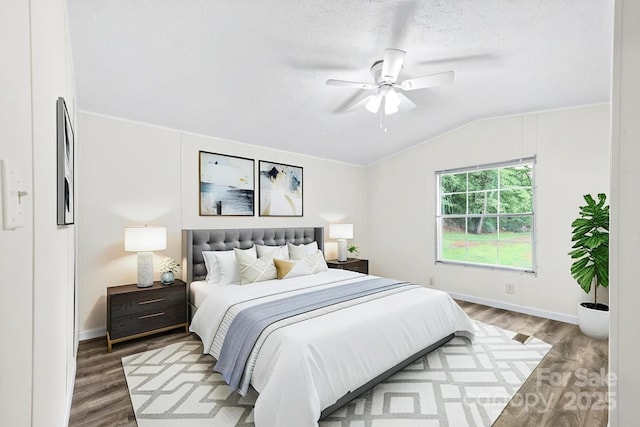1884 Kensway Dr, Hudson, NC 28638 - bedroom featuring wood finished floors, lofted ceiling, baseboards, and ceiling fan