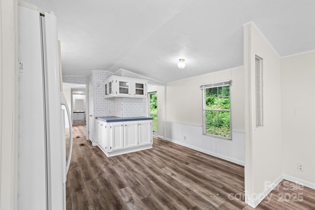 1884 Kensway Dr, Hudson, NC 28638 - kitchen featuring freestanding refrigerator, vaulted ceiling, white cabinets, glass insert cabinets, and dark wood-type flooring