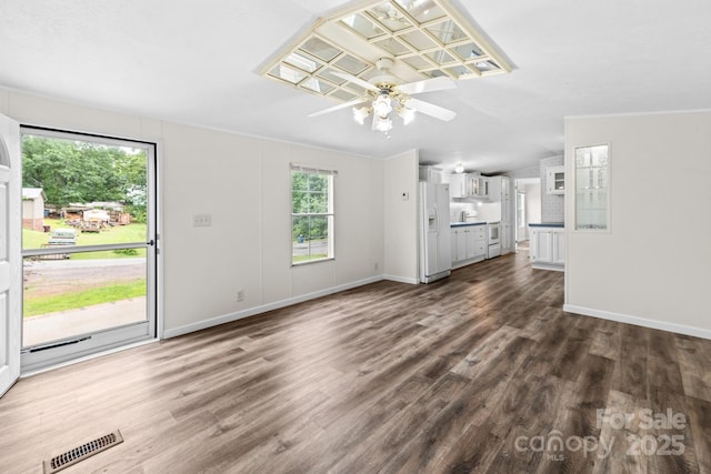 1884 Kensway Dr, Hudson, NC 28638 - unfurnished living room with a ceiling fan, dark wood finished floors, and baseboards