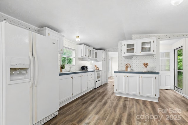 1884 Kensway Dr, Hudson, NC 28638 - kitchen featuring white appliances, lofted ceiling, white cabinetry, glass insert cabinets, and dark wood finished floors