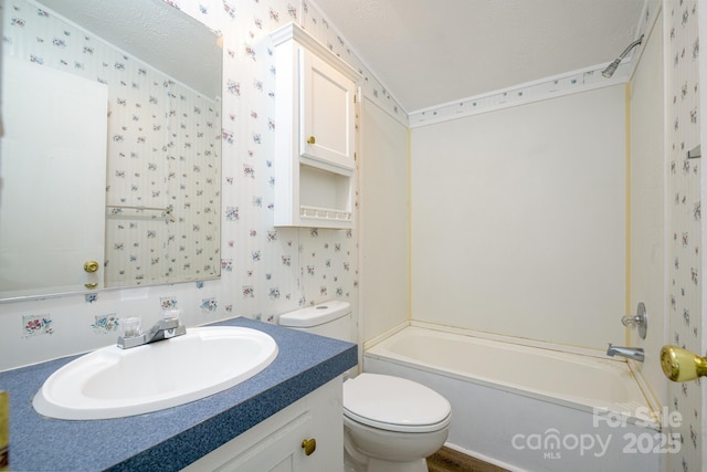 1884 Kensway Dr, Hudson, NC 28638 - bathroom featuring wallpapered walls, toilet, vanity, washtub / shower combination, and a textured ceiling