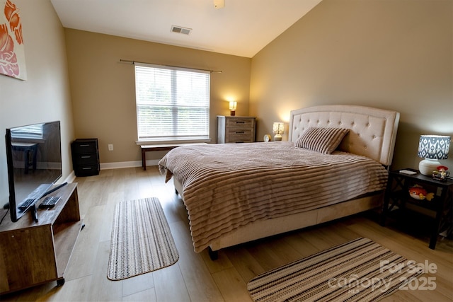 11867 Ridgeway Park Dr, Charlotte, NC 28277 - bedroom featuring wood finished floors and vaulted ceiling