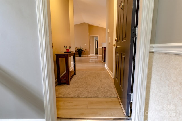 11867 Ridgeway Park Dr, Charlotte, NC 28277 - corridor with lofted ceiling, wood finished floors, and carpet