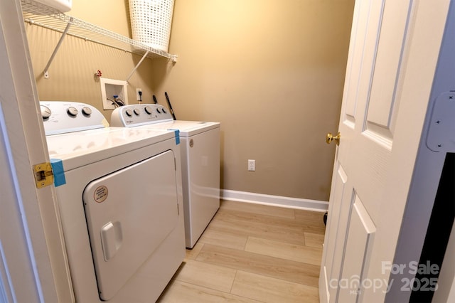11867 Ridgeway Park Dr, Charlotte, NC 28277 - laundry area with washing machine and clothes dryer and light wood finished floors