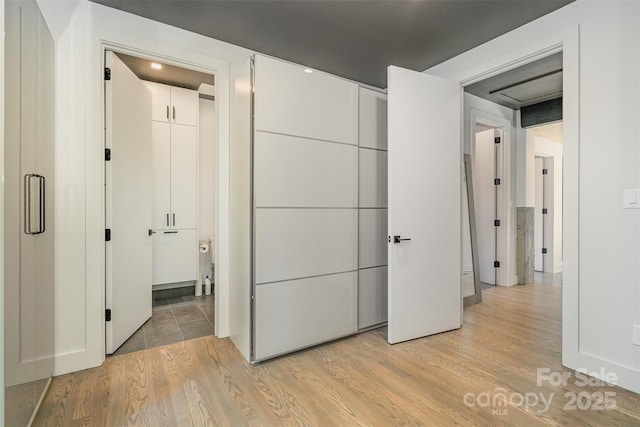 386 Squirrel Ln, Lake Wylie, SC 29710 - unfurnished bedroom with light wood finished floors and a closet