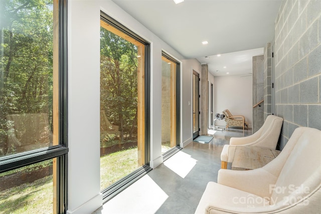 386 Squirrel Ln, Lake Wylie, SC 29710 - sunroom / solarium with finished concrete flooring, plenty of natural light, recessed lighting, and concrete block wall