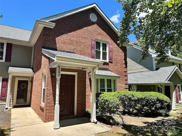 9404 S Vicksburg Park Ct, Charlotte, NC 28210 - view of front facade featuring brick siding and a shingled roof